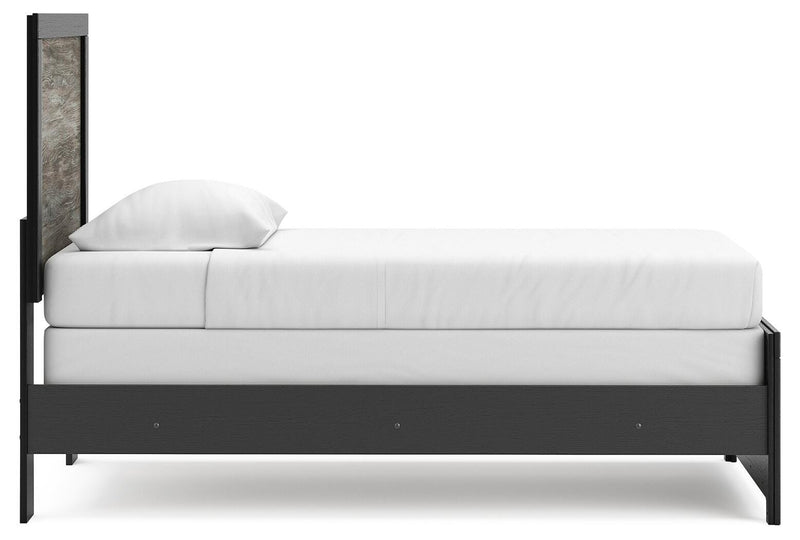 Ashley Furniture Broachmyn Bed with a sturdy wooden frame and elegant design, shown from the side view.