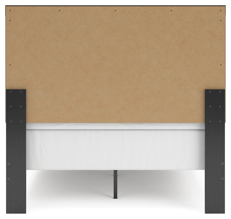 Ashley Furniture Broachmyn Bed with a stylish headboard and neutral fabric upholstery, shown from the back view.
