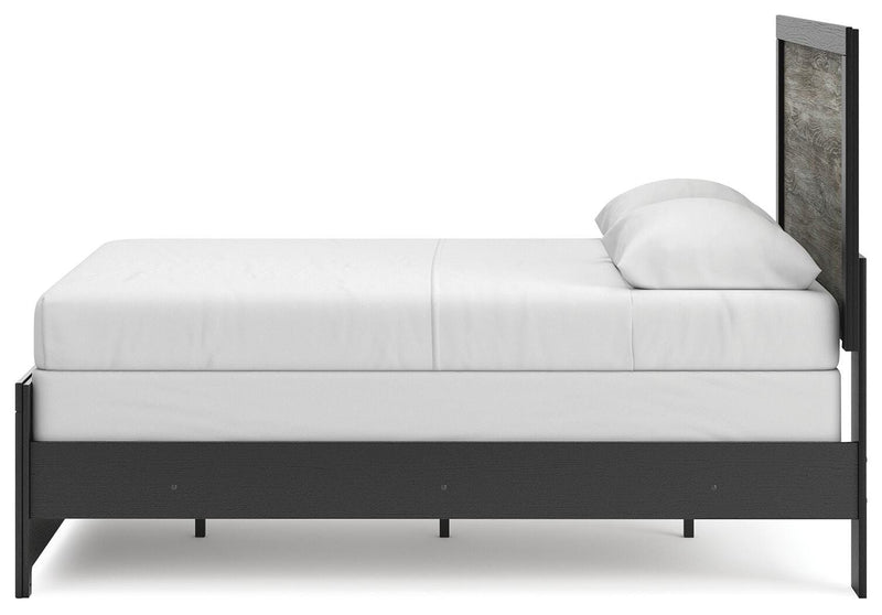 Ashley Furniture Broachmyn Bed with a sleek, modern design featuring a sturdy frame and elegant headboard.