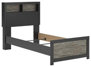 Ashley Furniture Broachmyn Bed showcasing a stylish bed frame with a polished wood finish and detailed headboard design.