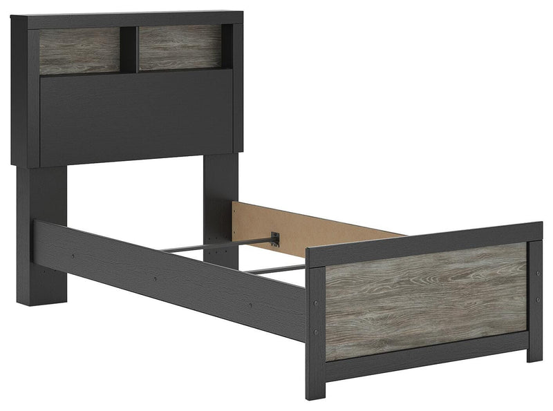 Ashley Furniture Broachmyn Bed showcasing a stylish bed frame with a polished wood finish and detailed headboard design.