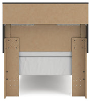 Ashley Furniture Broachmyn Bed with a wooden frame, headboard, and detailed design in a cozy bedroom setting.