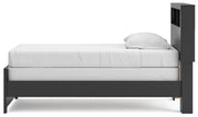 Ashley Furniture Broachmyn Bed with a wooden frame, showcasing a modern bed design with a headboard and side rails.