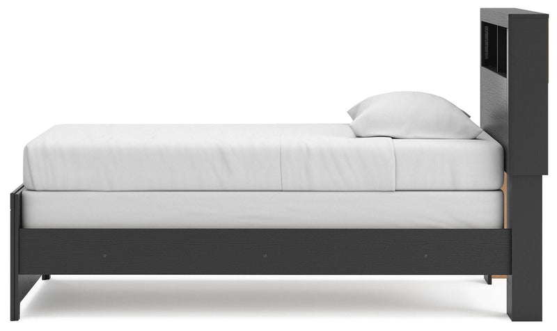 Ashley Furniture Broachmyn Bed with a wooden frame, showcasing a modern bed design with a headboard and side rails.