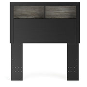 Ashley Furniture Broachmyn Bed with headboard featuring detailed wood design and a warm finish in a bedroom setting