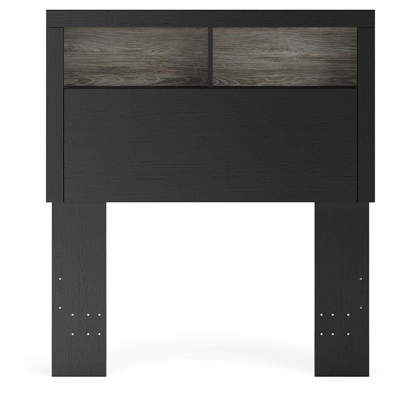 Ashley Furniture Broachmyn Bed with headboard featuring detailed wood design and a warm finish in a bedroom setting