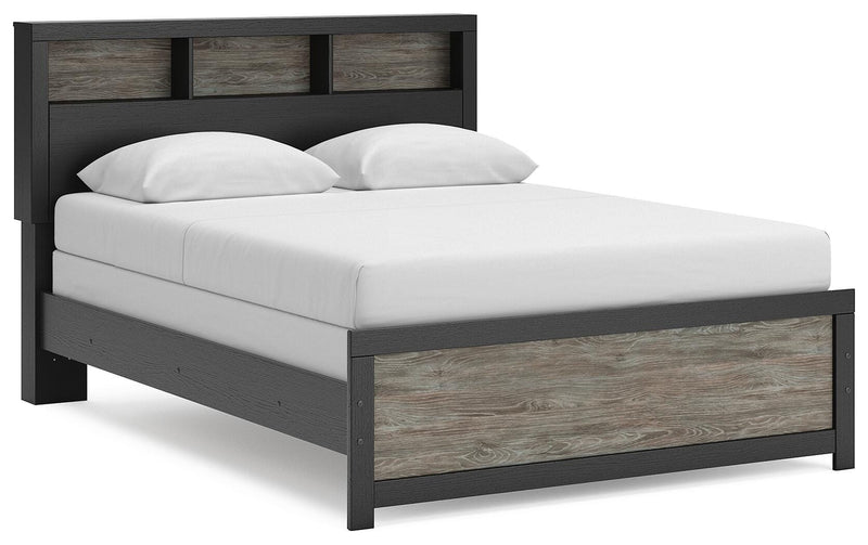 Ashley Furniture Broachmyn Bed with a dark wood finish, showcasing a stylish bed frame with a headboard and footboard.