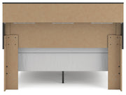 Ashley Furniture Broachmyn Bed with a stylish headboard, shown in a cozy bedroom setting with neutral bedding and modern decor.