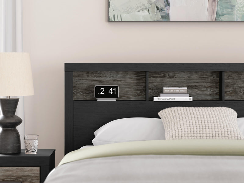 Ashley Furniture Broachmyn Bed with detailed wood finish and classic design, shown in a well-made bedroom setting.
