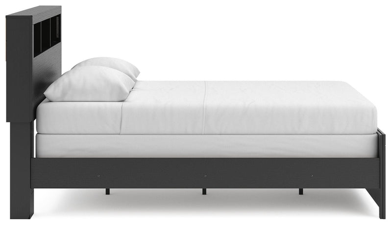 Ashley Furniture Broachmyn Bed in a stylish bedroom setting with a neutral-toned headboard and bedding.