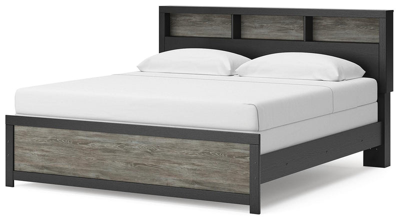 Ashley Furniture Broachmyn Bed with a sturdy wooden frame and classic design, shown from an angled view.