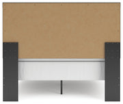 Ashley Furniture Broachmyn Bed with a dark wood finish, showcasing the headboard and elegant design details.
