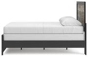 Ashley Furniture Broachmyn Bed with a modern design, showcasing its elegant wooden frame and neutral fabric upholstery.