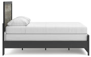 Ashley Furniture Broachmyn Bed with a stylish headboard and frame in a modern bedroom setting.