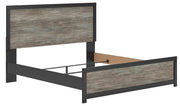 Ashley Furniture Broachmyn Bed with a stylish wooden frame and detailed headboard, shown from an angled perspective.