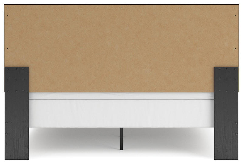 Ashley Furniture Broachmyn Bed with a sturdy wooden frame and elegant design, shown from the back view.