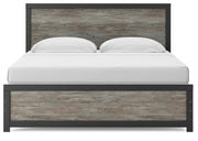 Ashley Furniture Broachmyn Bed with a headboard featuring intricate wood details, in a stylish bedroom setting.