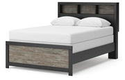 Ashley Furniture Broachmyn Bed with a modern design, showcasing its sleek frame and upholstered headboard from a side angle.
