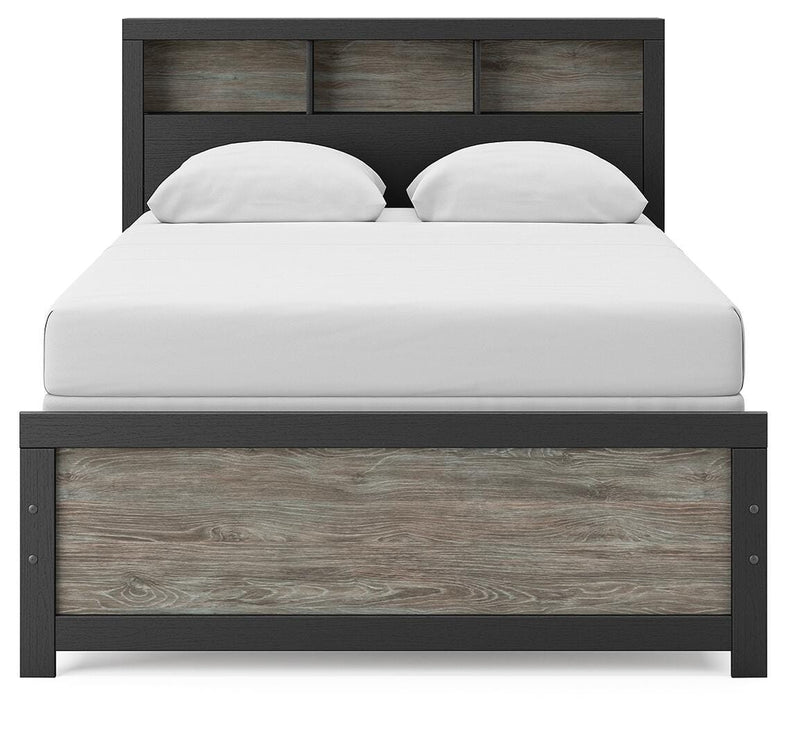 Ashley Furniture Broachmyn Bed with a stylish headboard, showcasing a modern design and detailed wood finish.