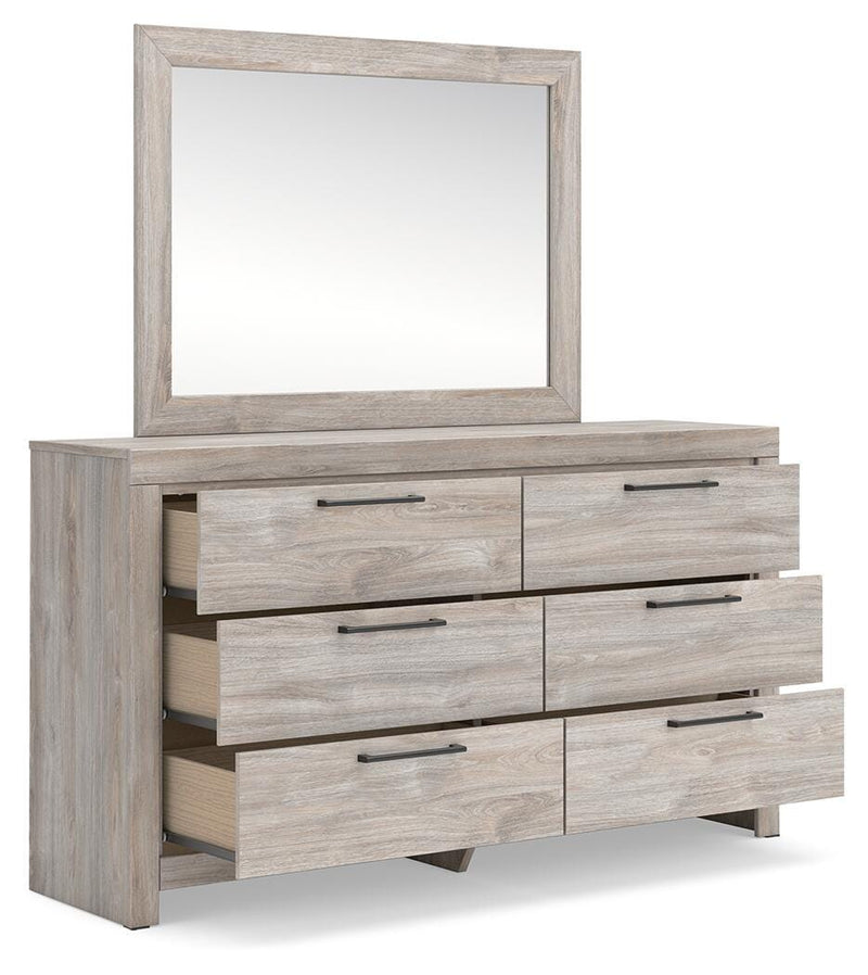 Ashley Furniture Broachmyn dresser and mirror set with open drawers, showcasing a stylish bedroom storage and decor piece.