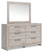 Ashley Furniture Broachmyn dresser with attached mirror, showcasing a wood finish and elegant design from a side angle.