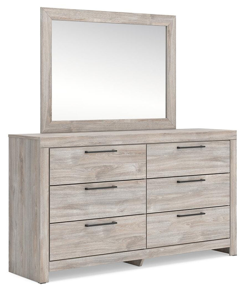 Ashley Furniture Broachmyn dresser with attached mirror, showcasing a wood finish and elegant design from a side angle.