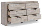 Ashley Furniture Broachmyn dresser and mirror set, angled view showing the elegant wood finish and spacious drawers.