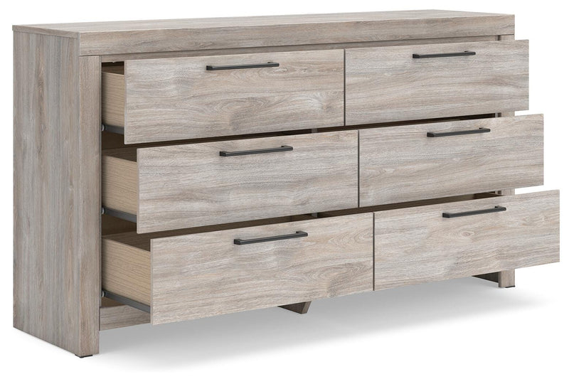 Ashley Furniture Broachmyn dresser and mirror set, angled view showing the elegant wood finish and spacious drawers.