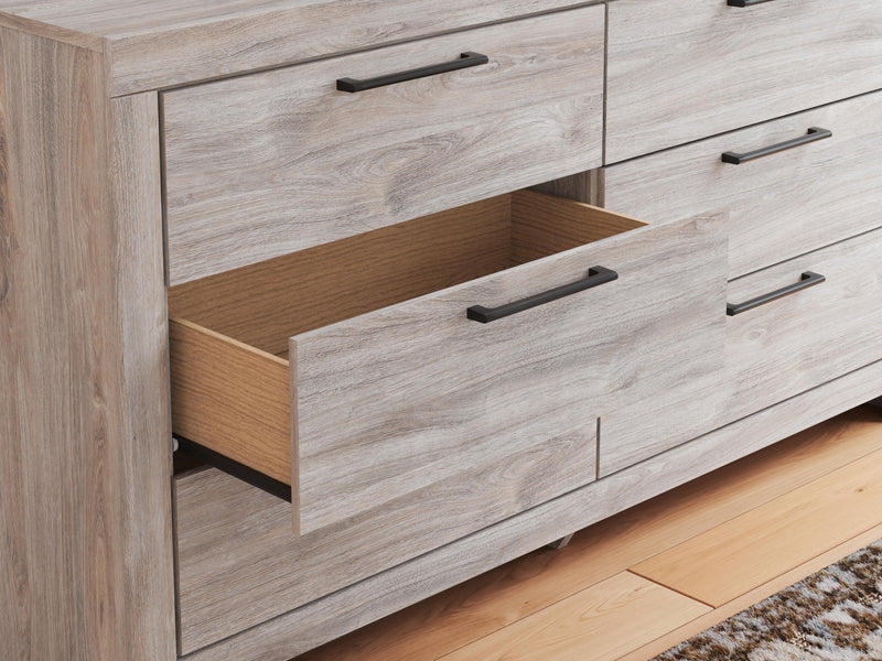 Ashley Furniture Broachmyn dresser and mirror set, featuring a wooden dresser with a matching framed mirror.
