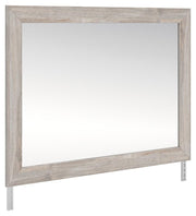 Ashley Furniture Broachmyn dresser and mirror set shown from an angle, featuring a dark wood finish and classic design.