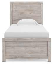 Ashley Furniture Broachmyn Bed with a wooden headboard and elegant design, shown in a modern bedroom setting.