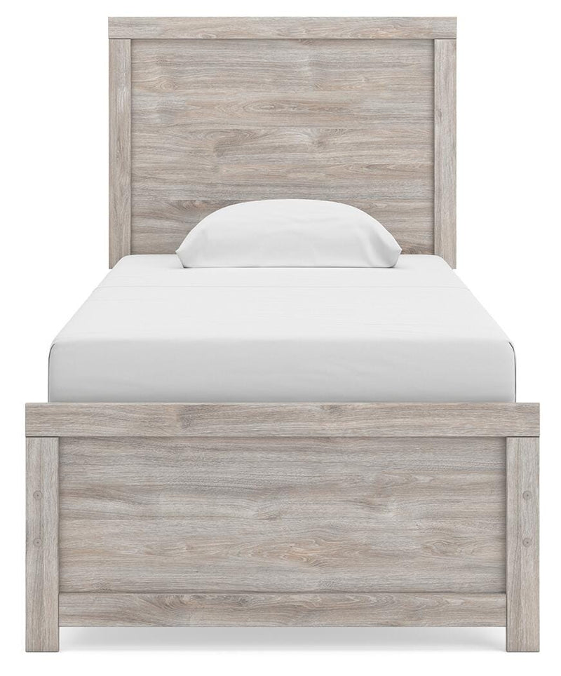 Ashley Furniture Broachmyn Bed with a wooden headboard and elegant design, shown in a modern bedroom setting.