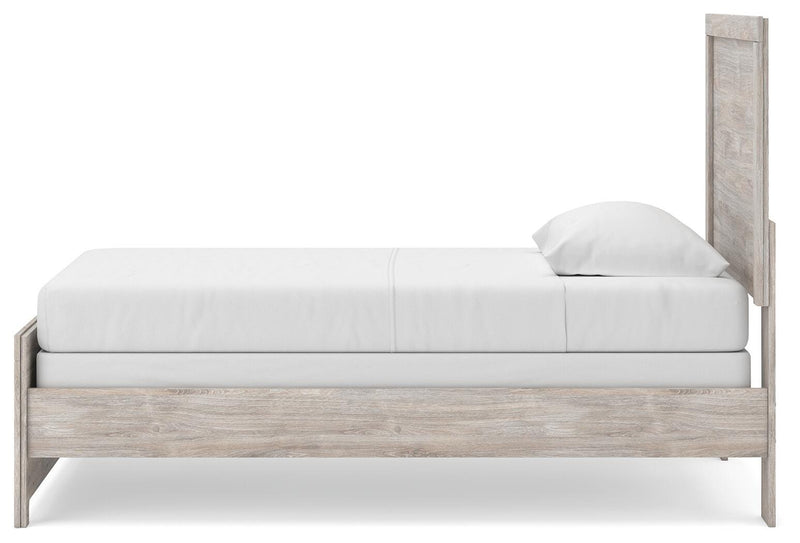 Ashley Furniture Broachmyn Bed with a wooden frame and headboard, shown in a side view with a warm finish.