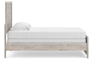 Ashley Furniture Broachmyn Bed in a natural wood finish, showcasing the side view of the modern bedroom bed design.
