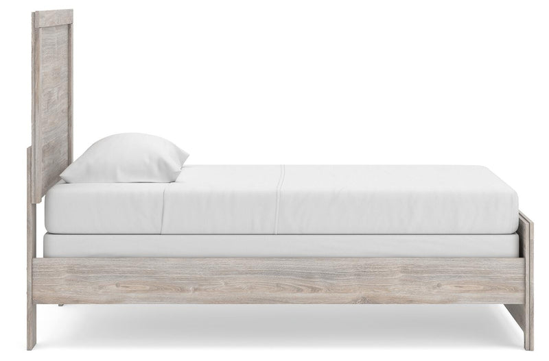 Ashley Furniture Broachmyn Bed in a natural wood finish, showcasing the side view of the modern bedroom bed design.