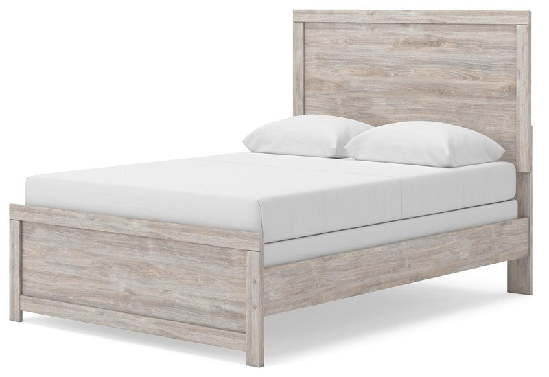 Ashley Furniture Broachmyn Bed with a classic wooden frame, shown from an angled view highlighting the headboard and footboard.