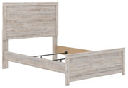 Ashley Furniture Broachmyn Bed with elegant wooden frame, shown at an angle highlighting its classic design and sturdy construction.