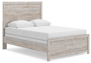 Ashley Furniture Broachmyn Bed with a stylish upholstered headboard and sturdy wooden frame, shown from an angled side view.