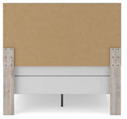 Ashley Furniture Broachmyn Bed with a dark wood finish, showcasing the headboard and classic design details.