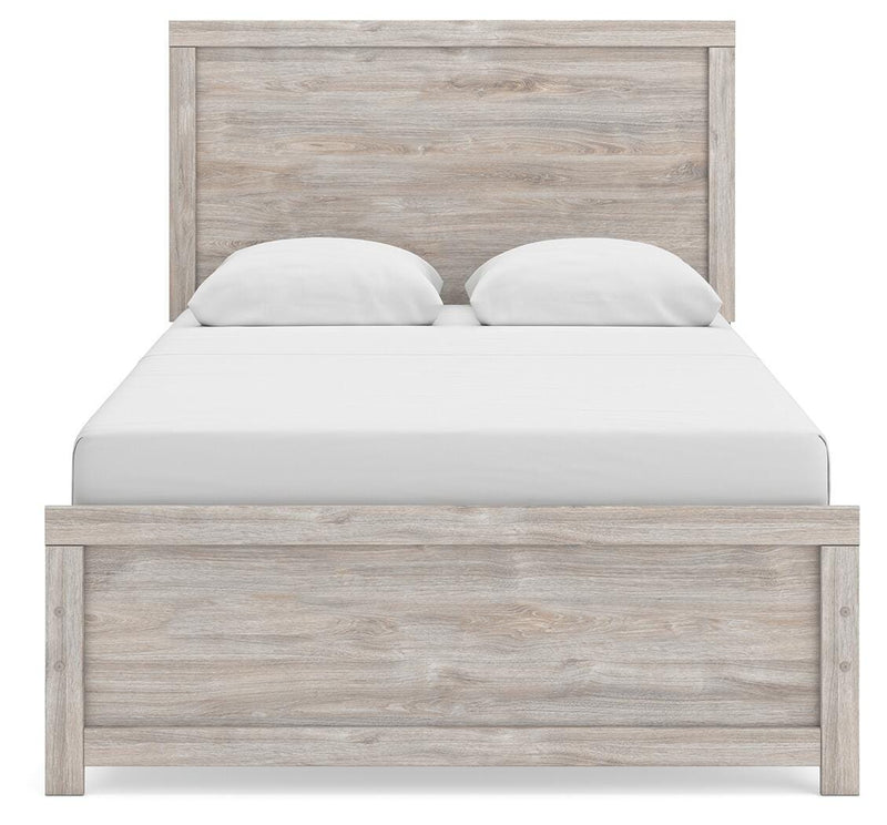 Ashley Furniture Broachmyn Bed with a headboard featuring a sleek, modern design in a bedroom setting.
