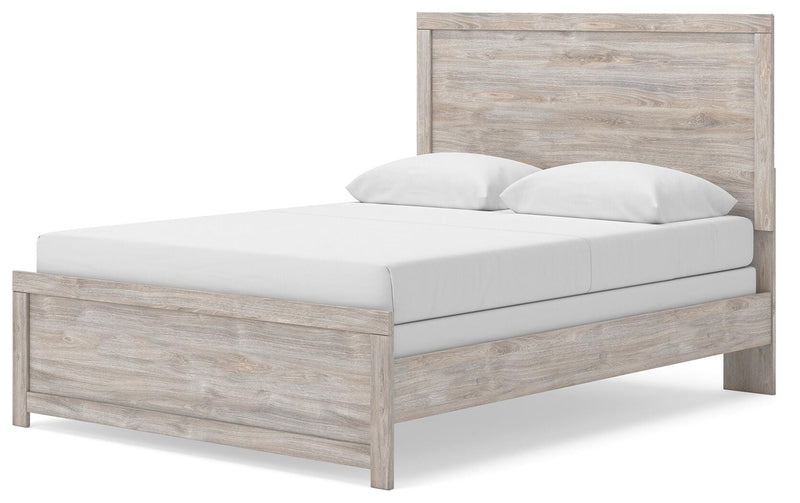 Ashley Furniture Broachmyn Bed with a stylish headboard and elegant design, shown from an angled side view.