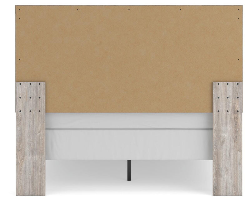 Ashley Furniture Broachmyn Bed with a sturdy wooden frame and upholstered headboard, shown from the back view.
