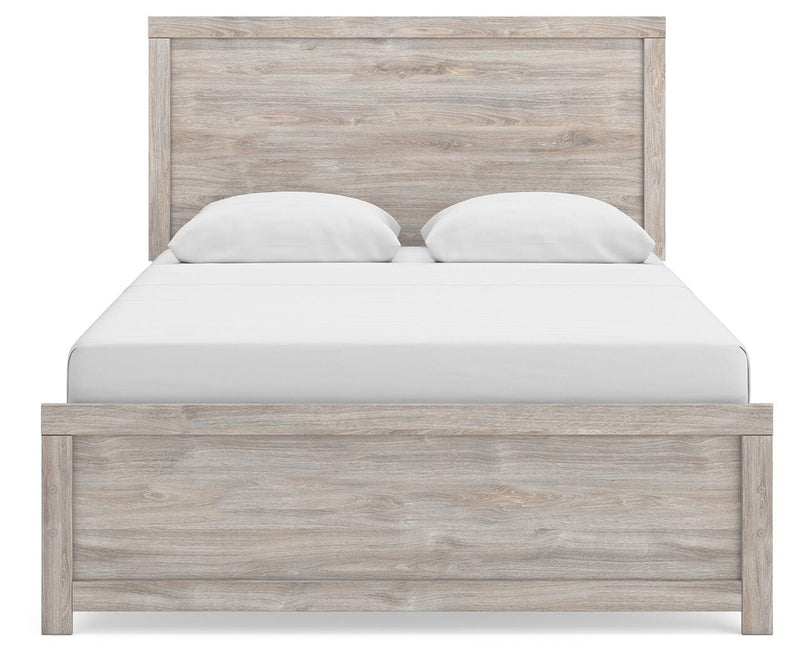 Ashley Furniture Broachmyn Bed with a neutral upholstered headboard and stylish design, shown in a head-on view.