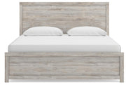 Ashley Furniture Broachmyn Bed with headboard and bedding in a cozy bedroom setting