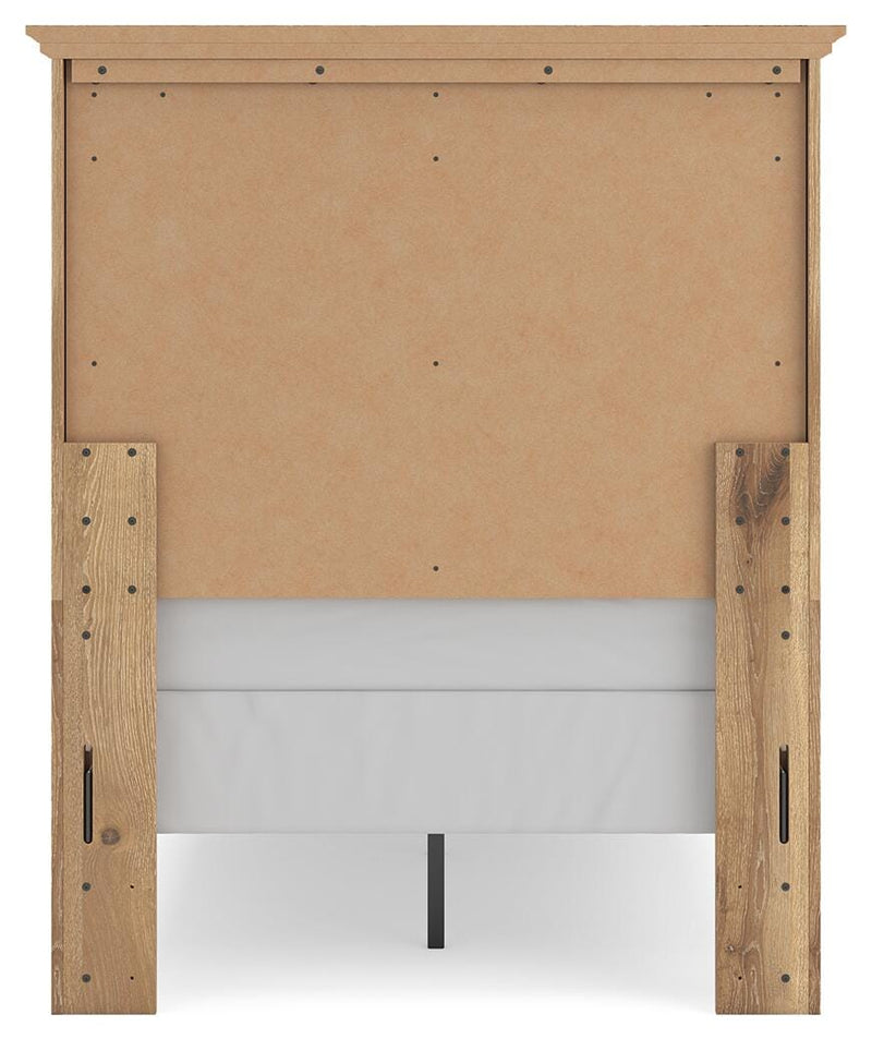 Ashley Furniture Makidern Bed with a stylish headboard and dark wood finish, shown from a side angle.