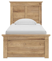 Ashley Furniture Makidern Bed with a close-up view of the headboard showcasing detailed woodwork and a rich finish.