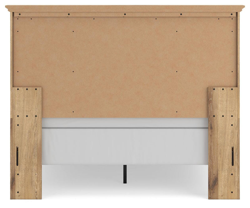 Ashley Furniture Makidern Bed with a dark wood finish and elegant headboard design, showcasing a stylish bedroom centerpiece.