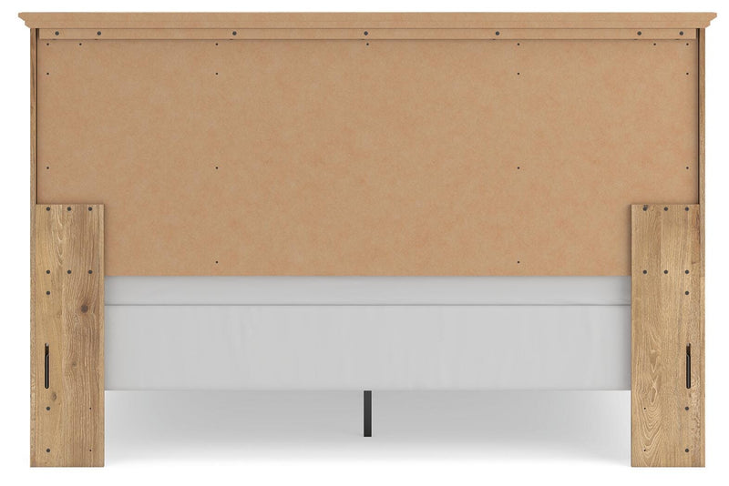 Ashley Furniture Makidern Bed with a sturdy wooden frame and classic design shown from the back view.