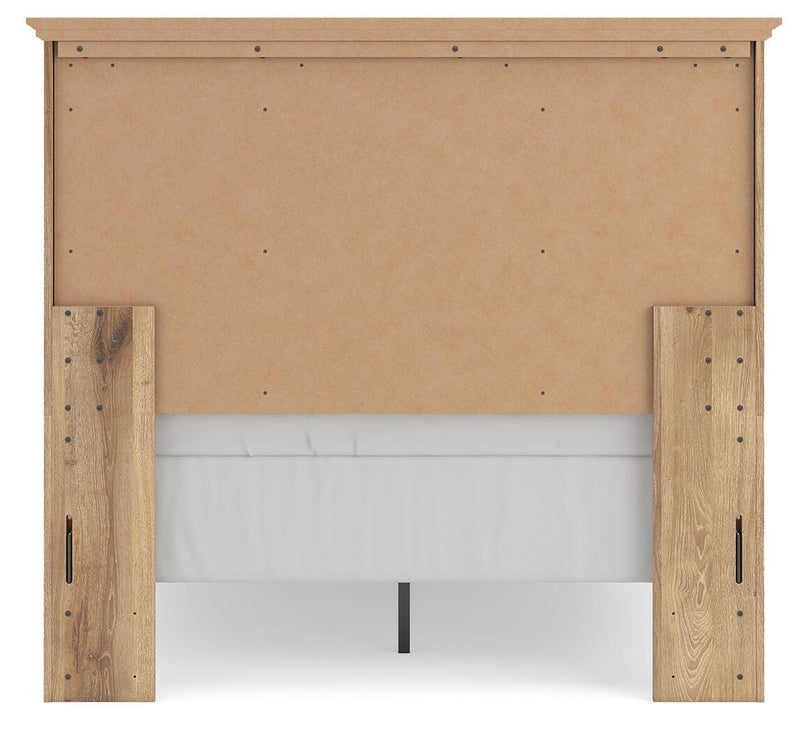 Ashley Furniture Makidern Bed with a stylish upholstered headboard and wooden frame, shown from the back view.