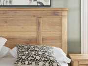 Ashley Furniture Makidern Bed with detailed headboard in a modern bedroom setting